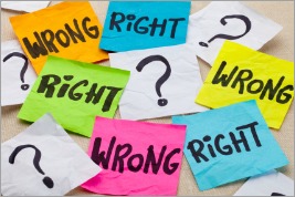 wrong or right dilemma or ethical question - handwriting on colorful sticky notes